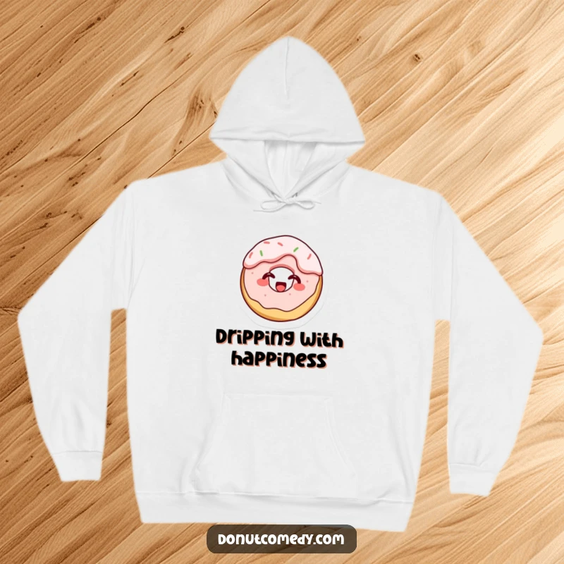 Funny hoodie with a tiny cake donut character, completely covered in frosting, emitting a joyful giggle, a humorous and comforting item.
